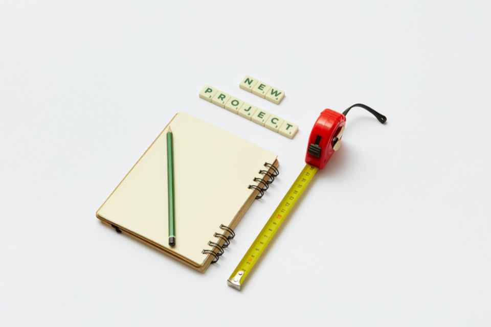 notebook and measuring tape for starting a new project